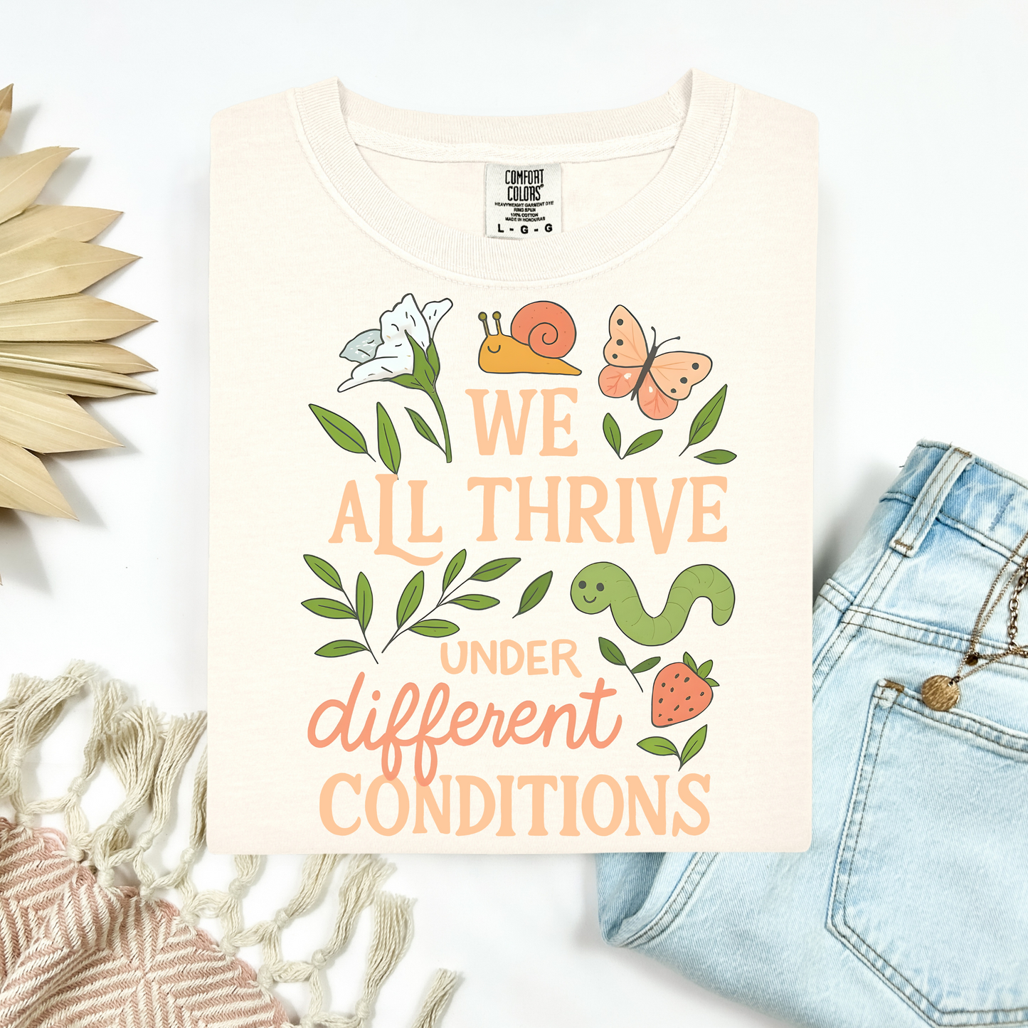 We All Thrive Tee.